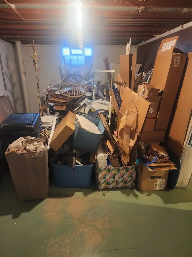 Roll-off dumpster container at job site for Yard Waste Dumpster Rental in Holland